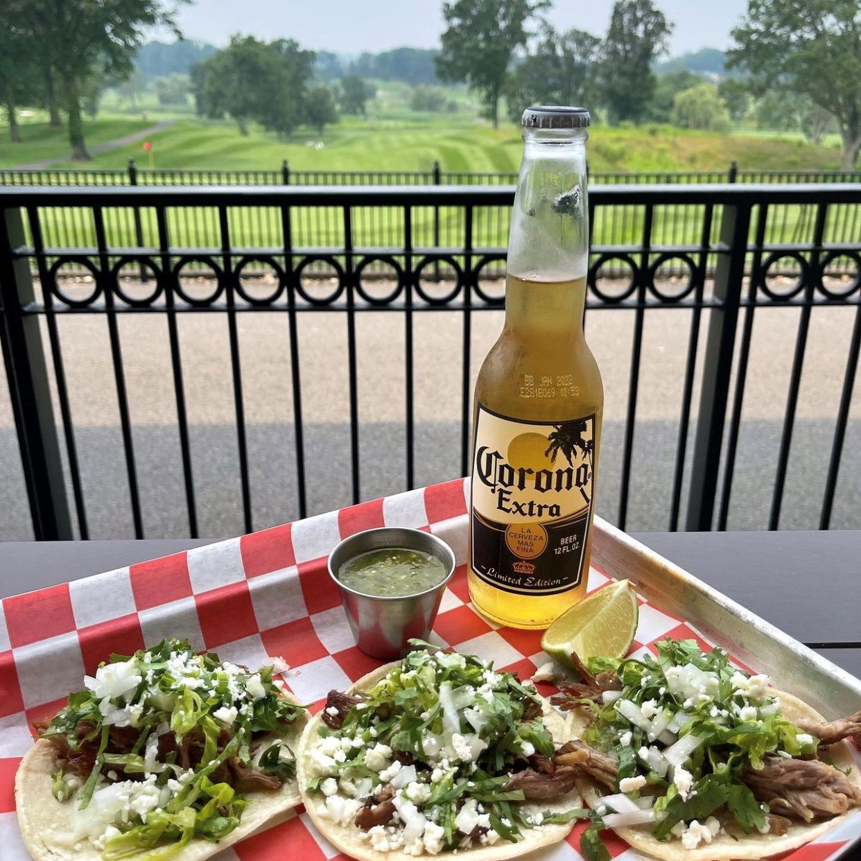 Three shredded beef tacos served with a Corona Extra overlooking the golf course at The Hill Tavern Bar & Grill at Galloping Hill Golf Course in Kenilworth, NJ.