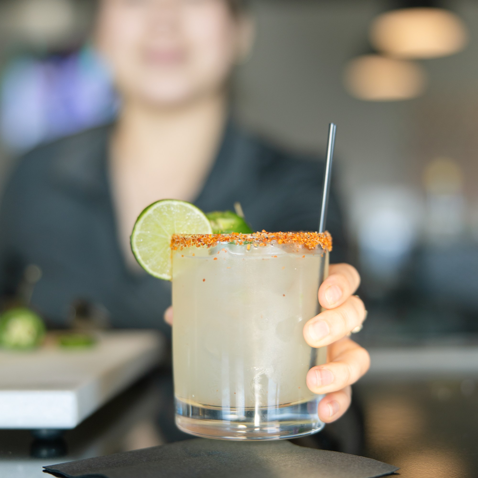 A bartender serving a spicy margarita with a tajin rim at The Hill Tavern Bar & Grill at Galloping Hill Golf Course in Kenilworth, NJ.